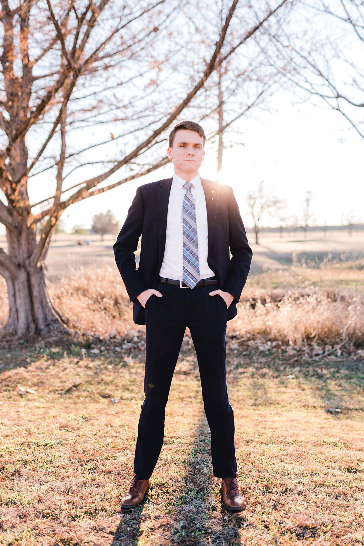 Austin senior boy in suit and tie. Outside in Austin Texas.
