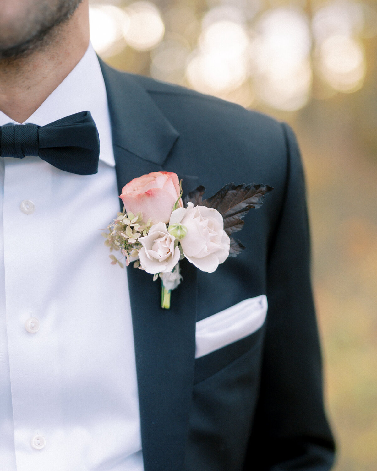 Classic pink boutonniere by Floral & Field Design Co, feminine Calgary, Alberta wedding florist, featured on the Brontë Bride Vendor Guide.