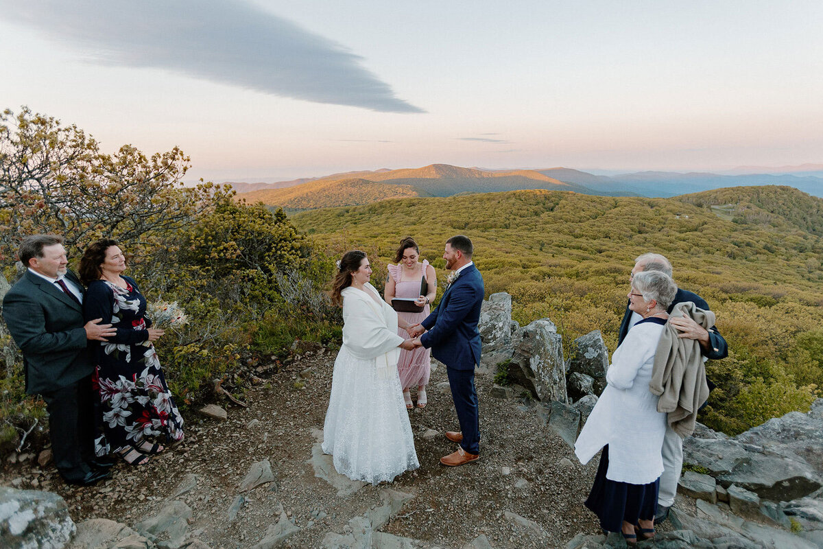 A bride and groom surrounded by their parents and officiant during their Shenandoah elopement