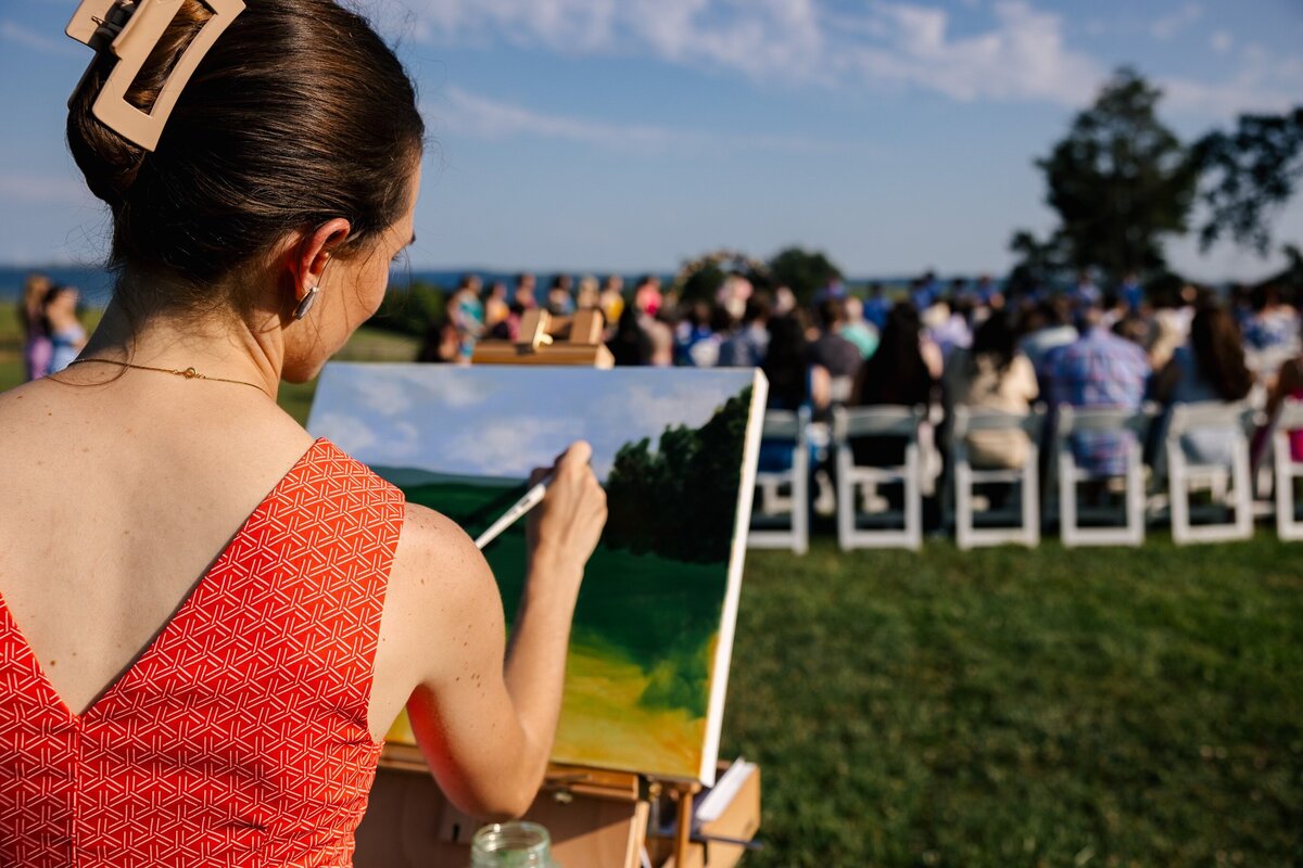 Hannah Brauckmann painting a live wedding painting 18x24 in Pennsylvania 