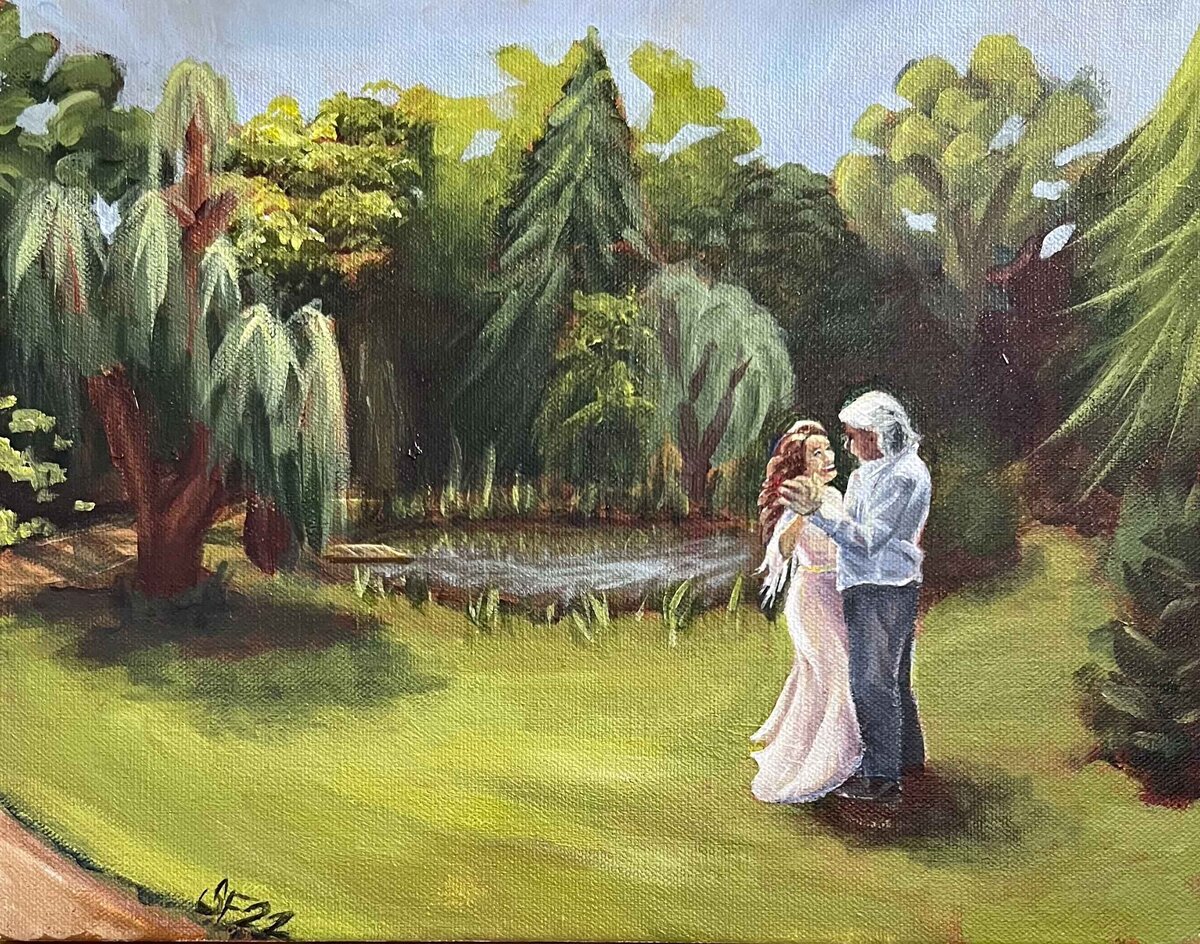 Bride and groom dancing outside