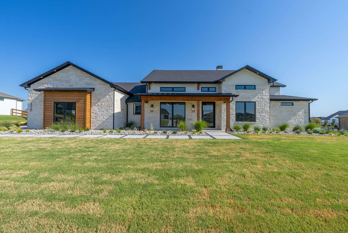 Modern custom home design with stone accents