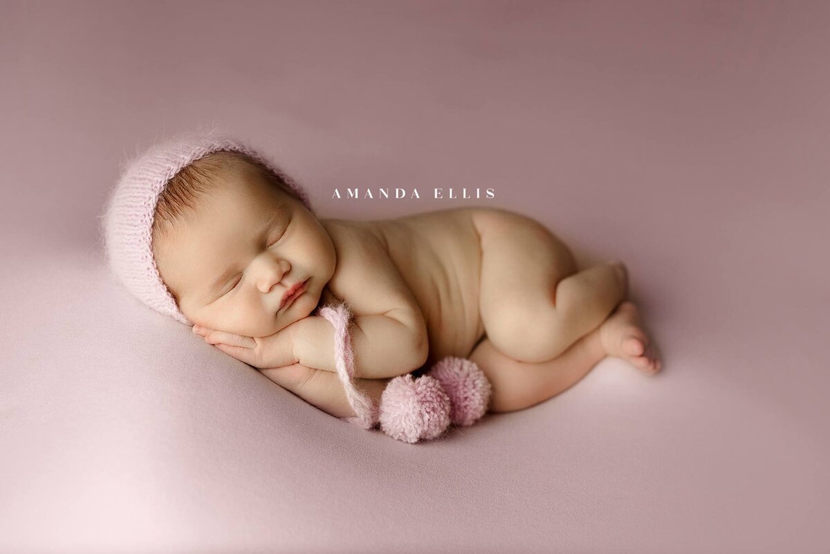 Luxurious newborn portrait in pastel pink set