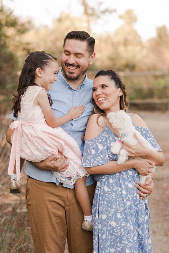 family-laughing-together-with-dog-Bonita-San-Diego