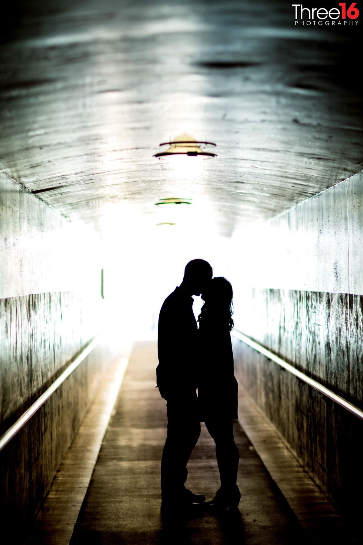Silhouette of engaged couple kissing at the Los Angeles Union Station