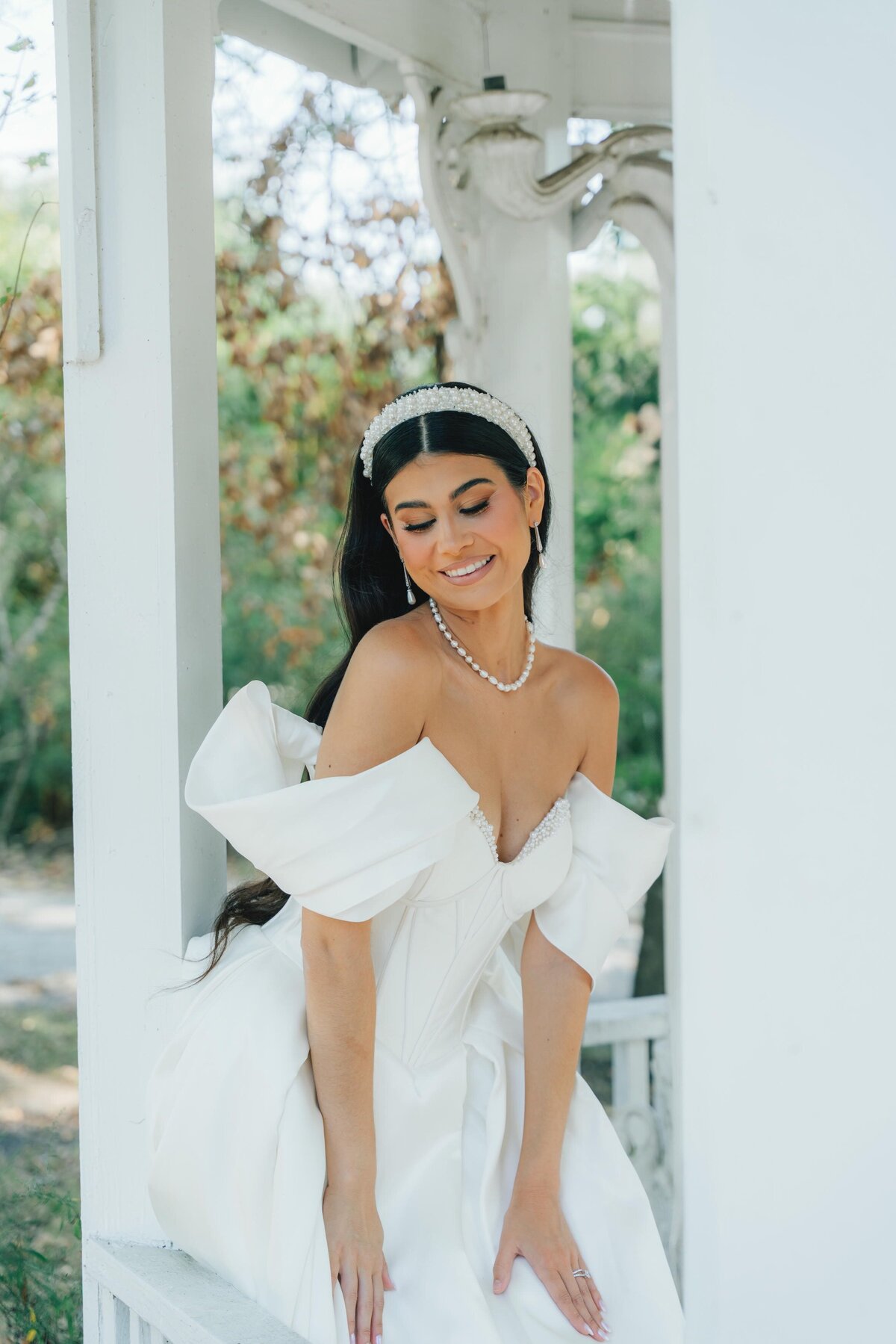 Elegant bridal session in a white Cinderella wedding dress by Happily Ever After at venue Heaven on Earth in Houston Texas 