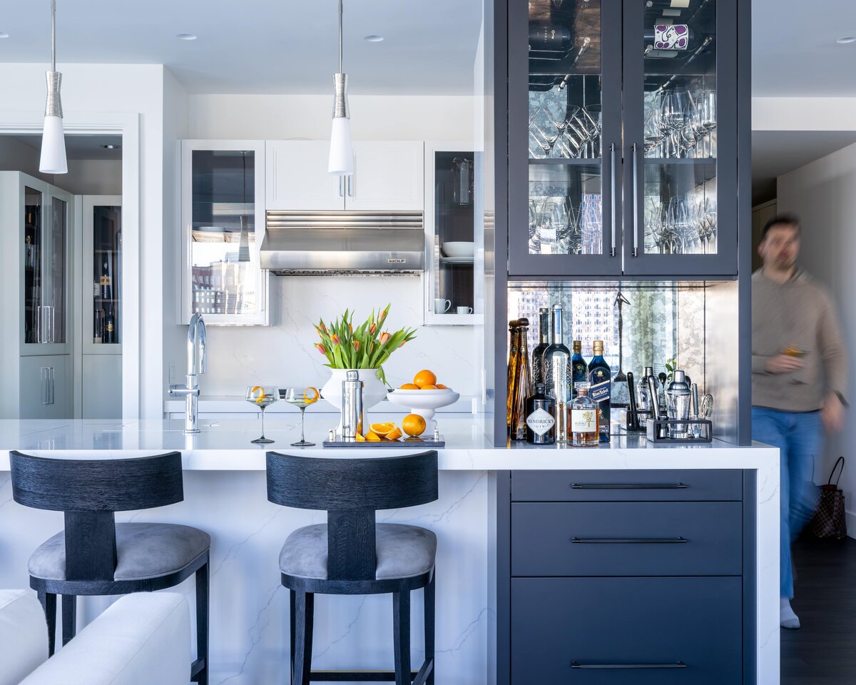 Modern kitchen with built-in bar in a Seaport Boston condo, featuring clean lines and contemporary finishes