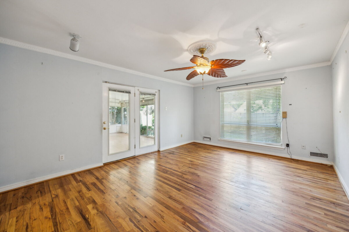 14214_edgecrest_dr_dallas_tx_family_room_with_hardwood_floors_-large_window_natural_light_and_sunroom_access-_haven_realty_group