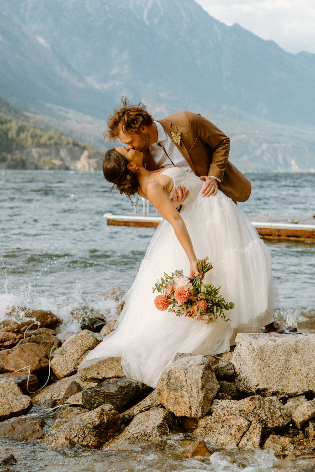 Bride and groom kissing at Whistler wedding - Within the Flowers