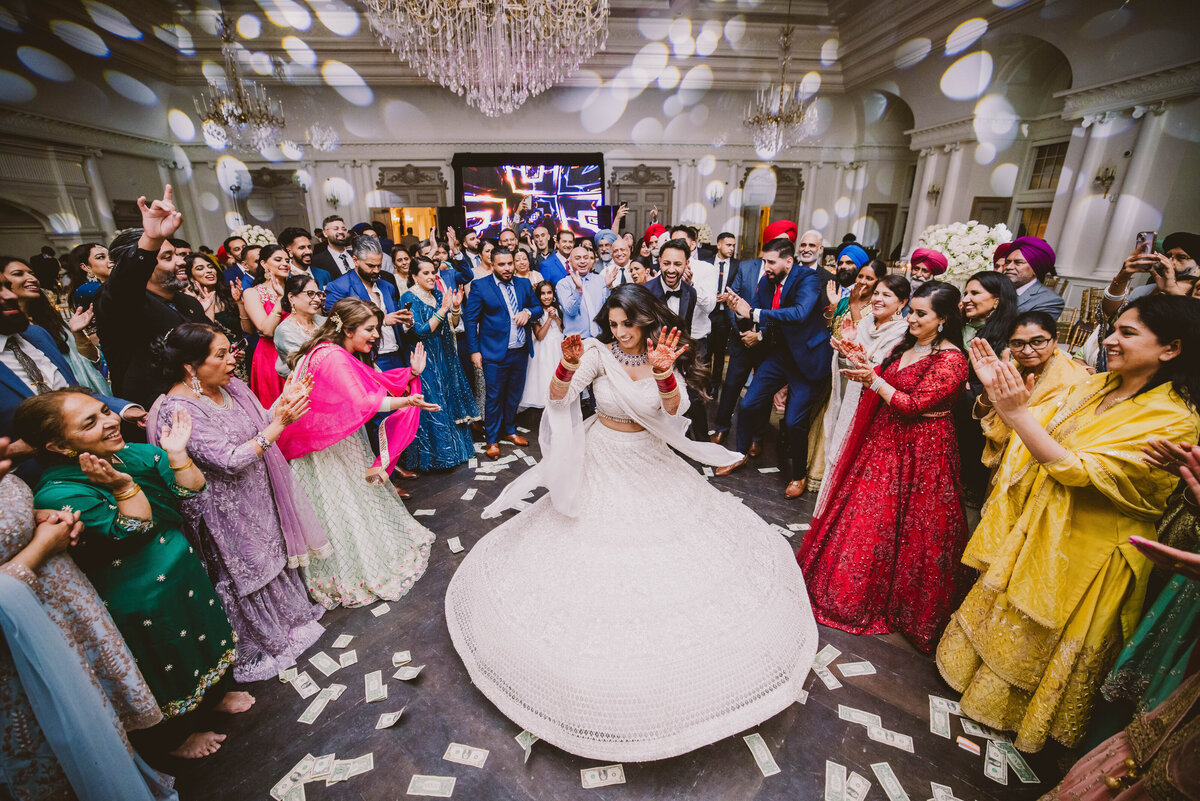 sikh bride twirling during the dance floor at the wedding reception at park chateau in nj