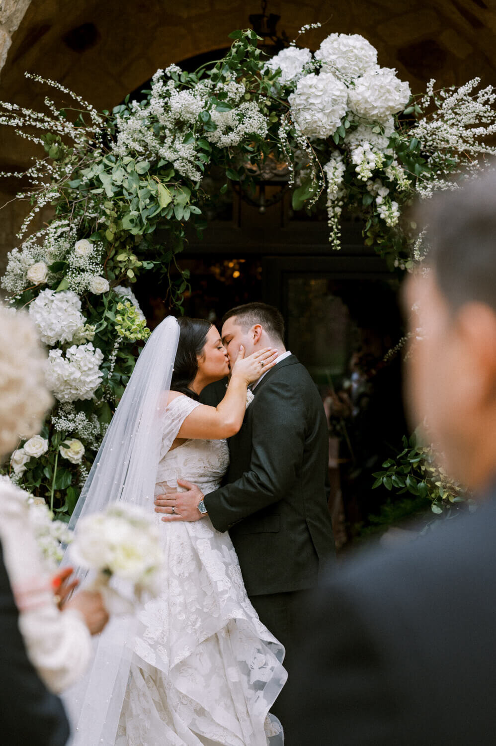 first-kiss-framed-by-guests