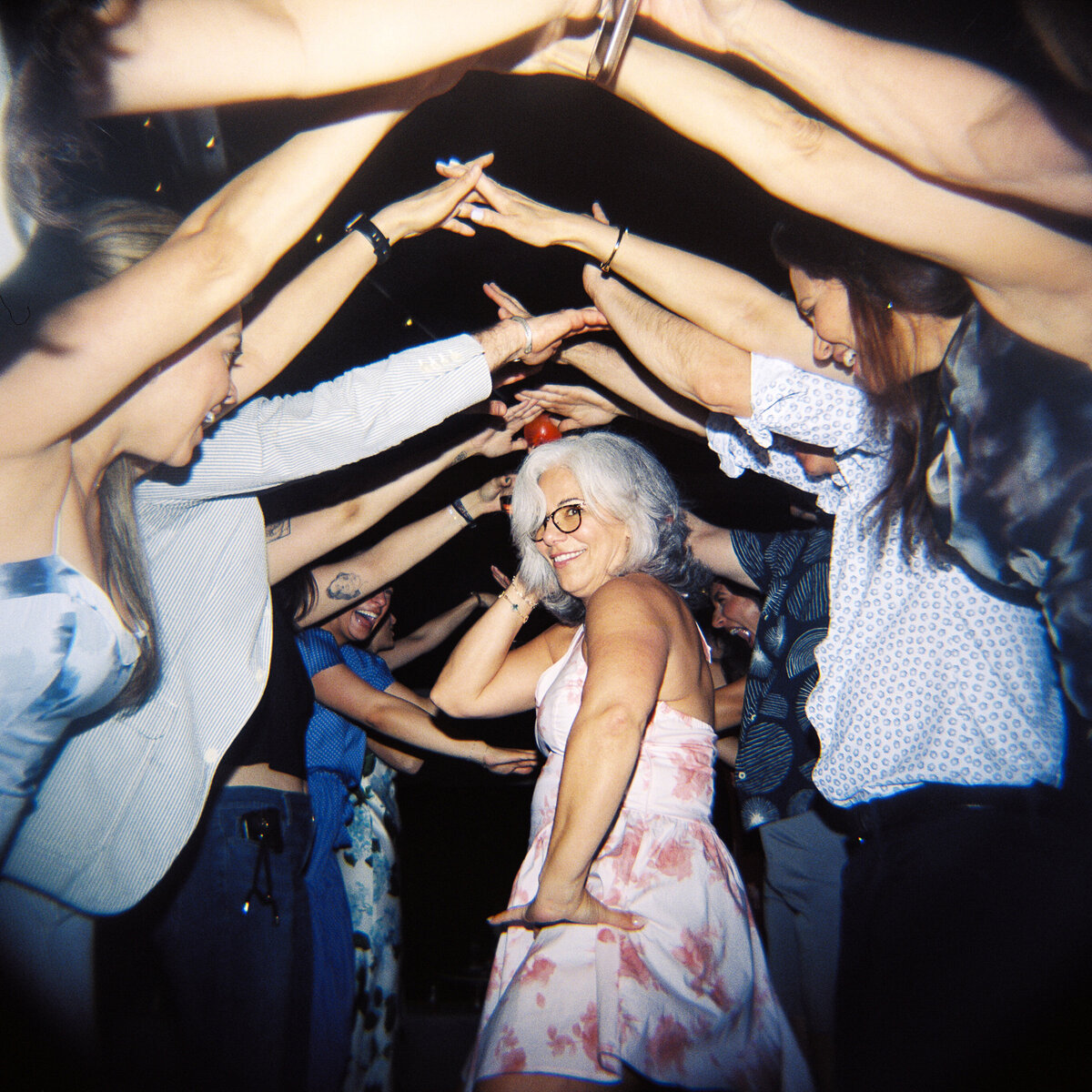 Photo of guests dancing on film in private backyard party by Mira Park Photography NY based wedding photographer