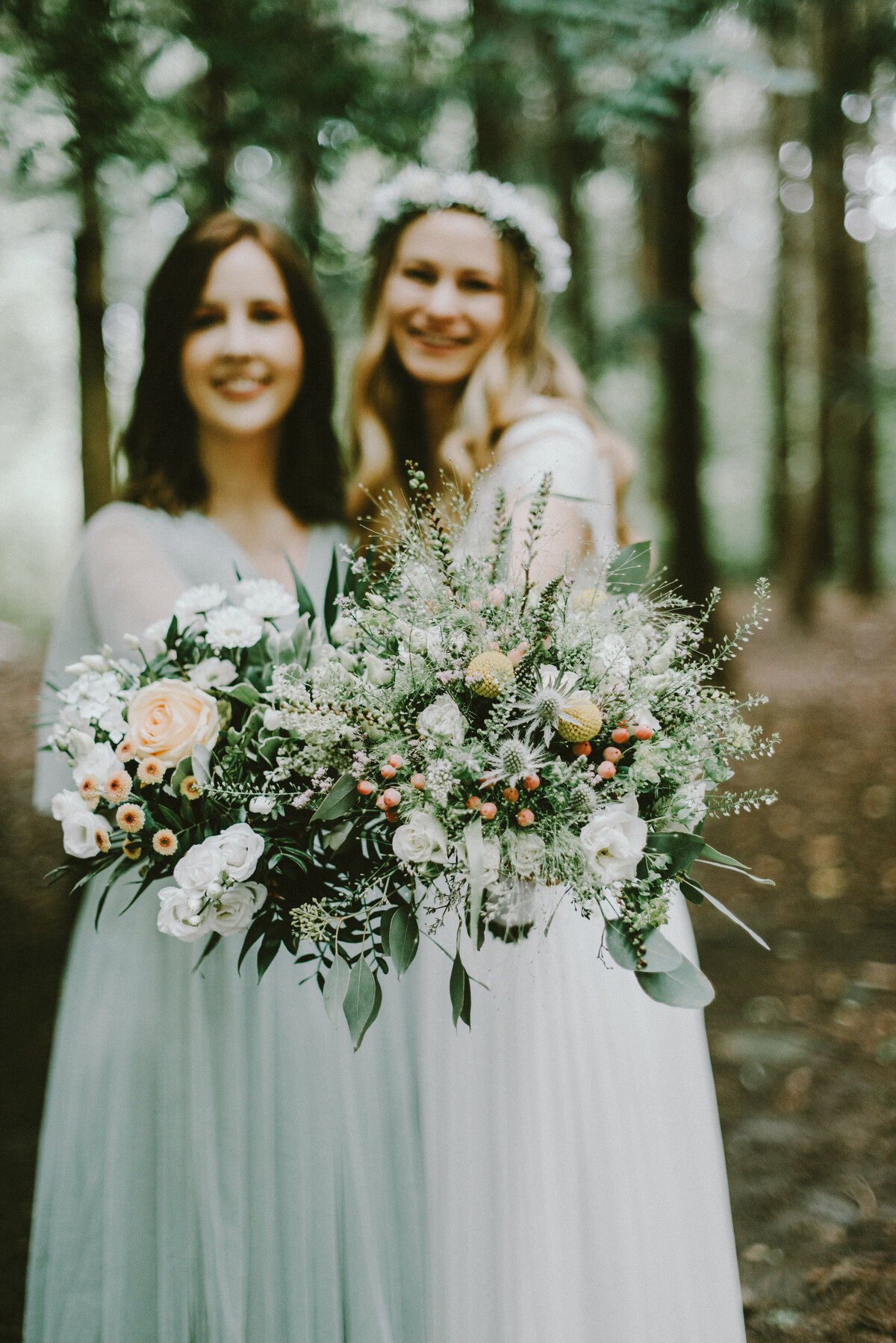 Two brides with their bridal bouquets enjoying their microwedding abroad