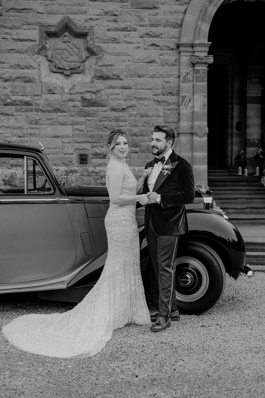 Bride holding groom's hands black and white image