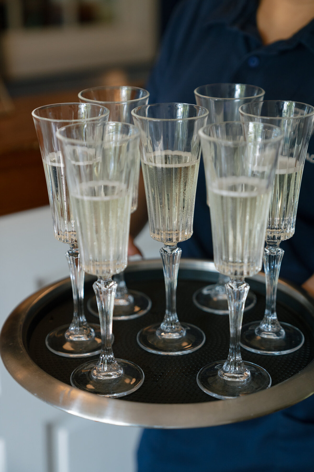 Champagne flutes on tray captured by shelby ann photos