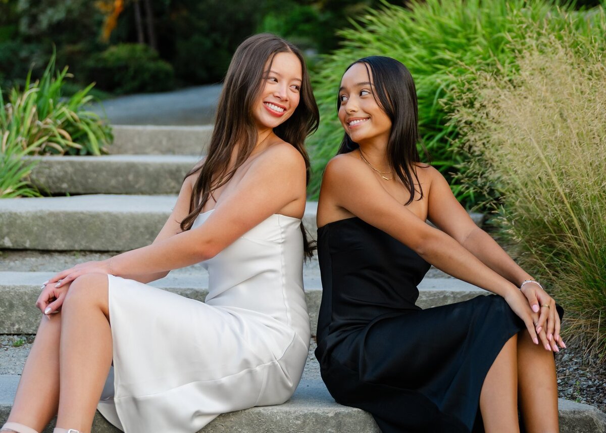 bellevue botanical park best friends pose in dresses on stairs