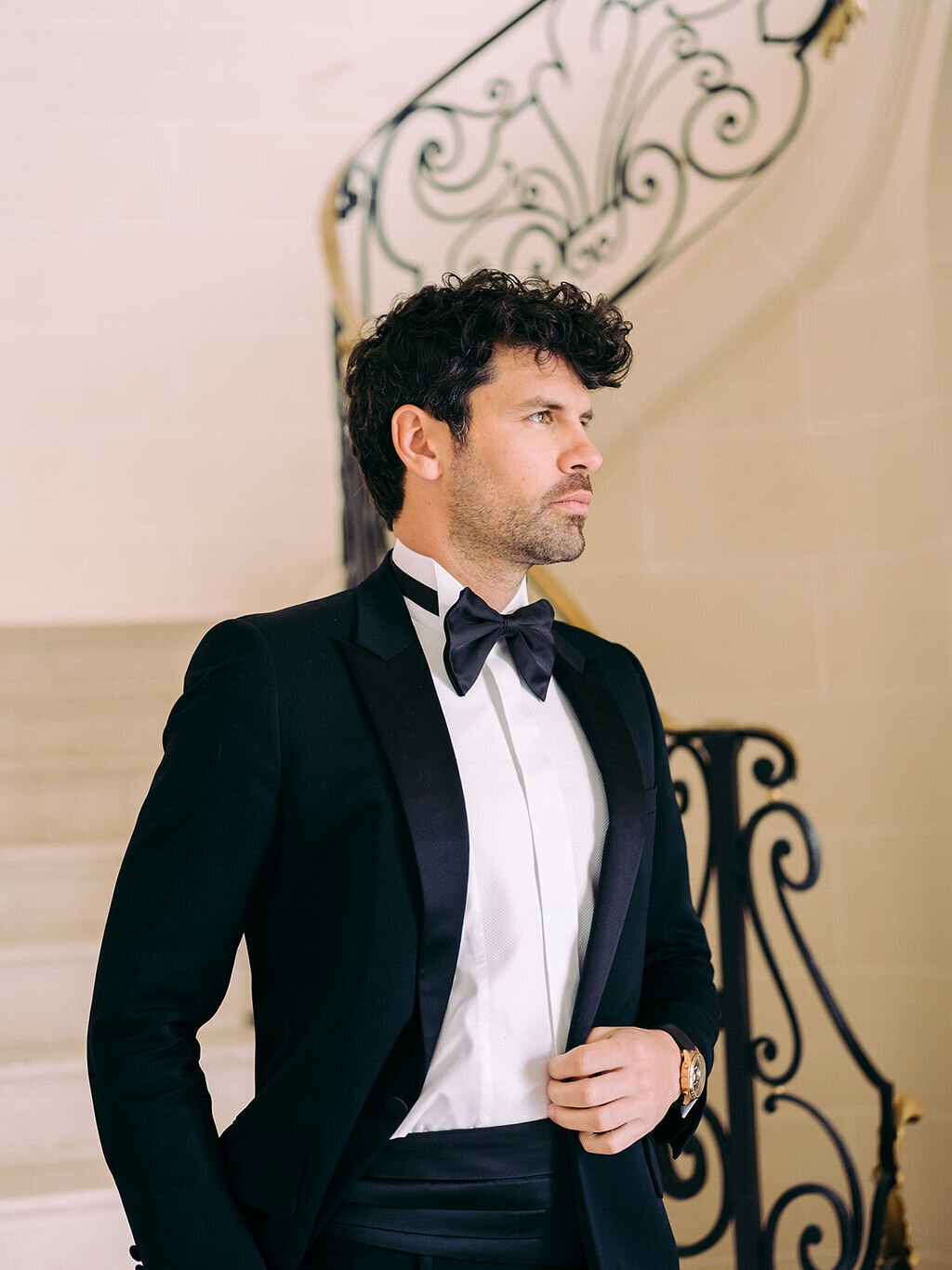 the groom in the magnificent staircase in a Château in Paris