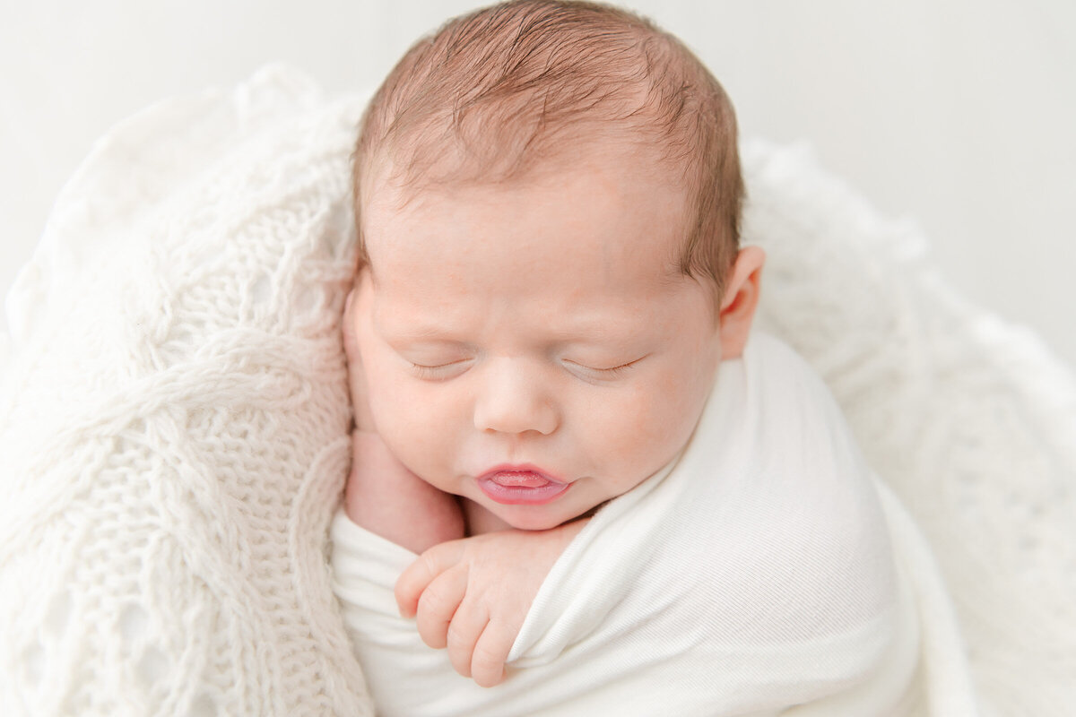 sleeping baby with tongue sticking out