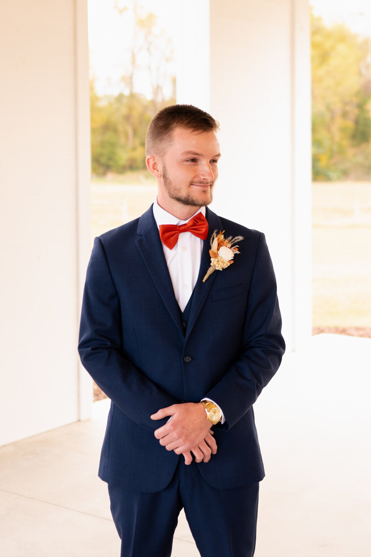 The groom patiently waiting for his bride to walk down the aisle at Stokes Family Farm in Greenville, NC.