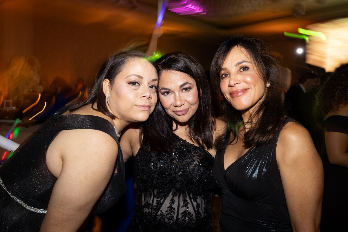 three females wearing black