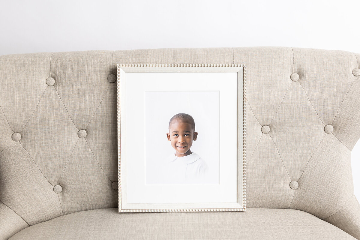 Framed Timeless photography
heirloom portrait on tufted sofa