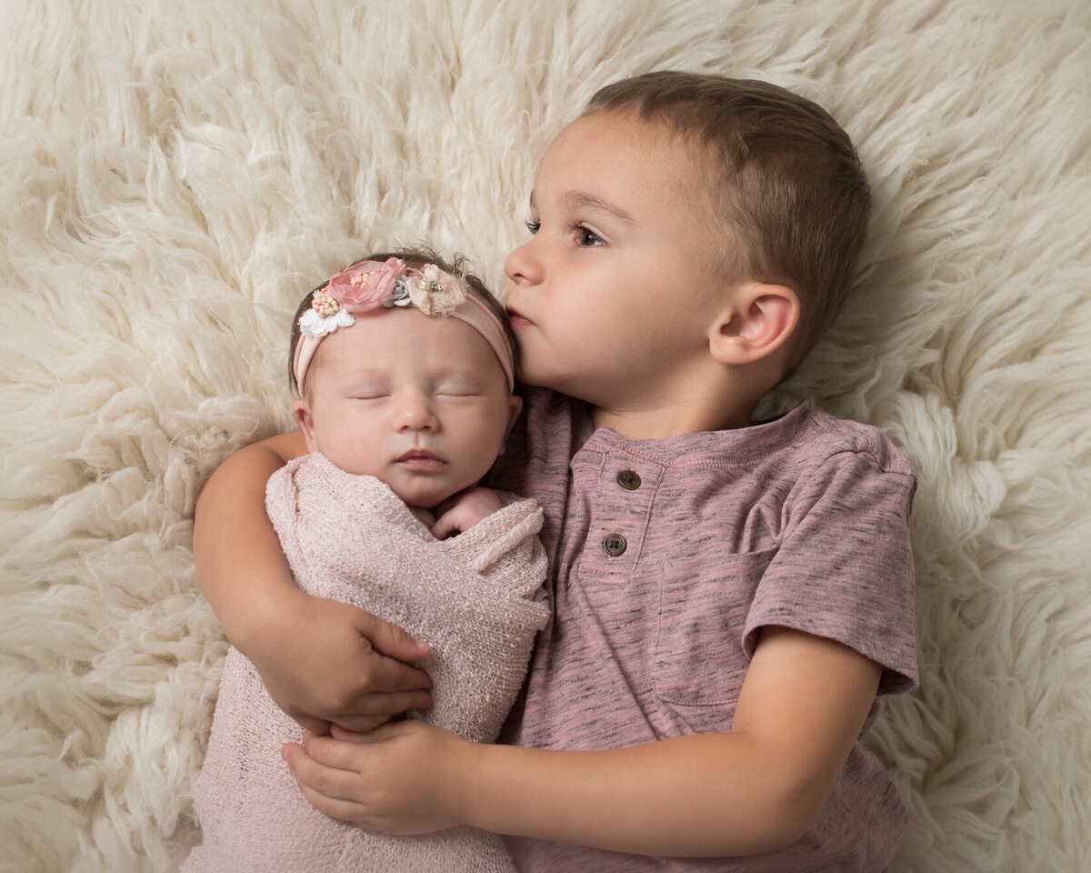 Newborn and Sibling sweet moment captured in Houston