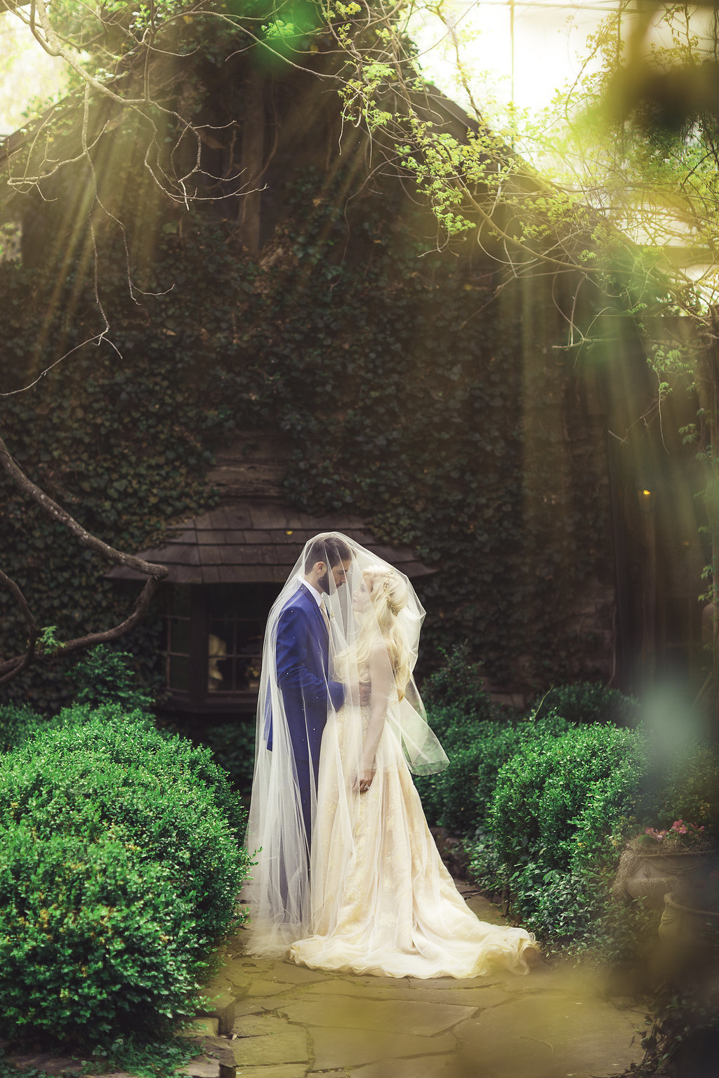 Wedding Photograph Of Bride and Groom Covered in Bride's Veil Los Angeles