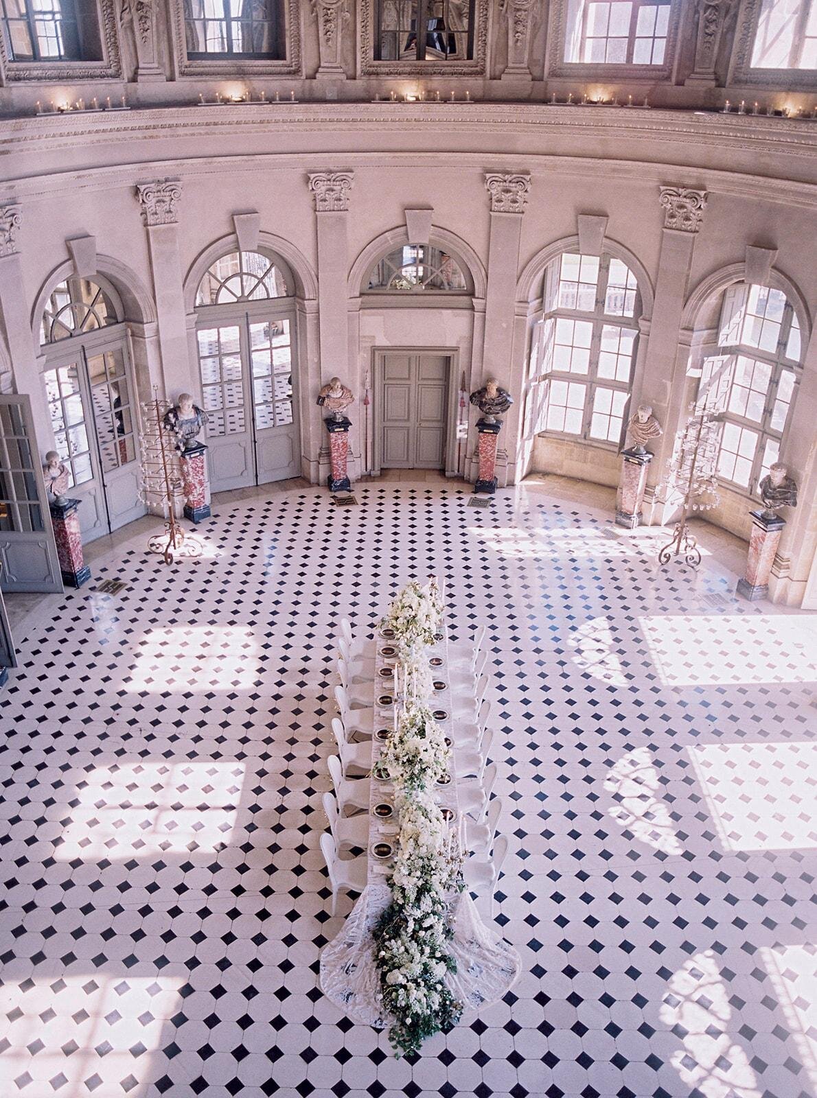 The stunning photo at Chateau Vaux le Vicomte in Paris, France was captured by photographer Audrey FORA, known for her exquisite work in capturing unforgettable moments.