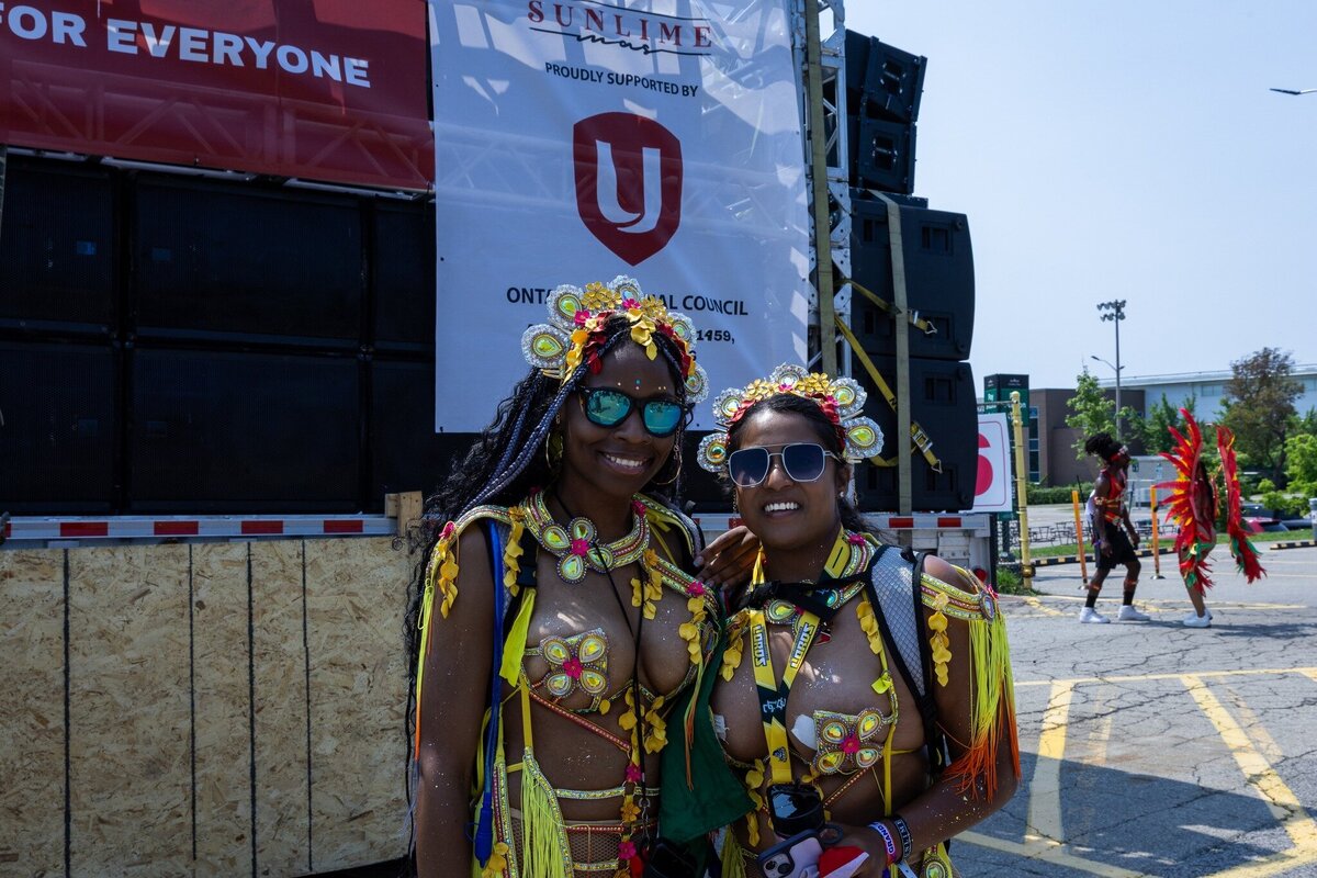Toronto caribbean carnival parade masquerader in costume with Sunlime Mas, the number 1 medium size band at Toronto Carnival.