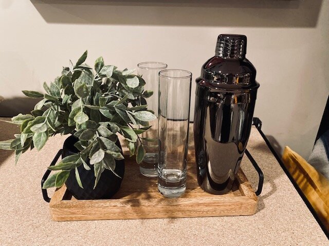 Plant with shaker and glasses