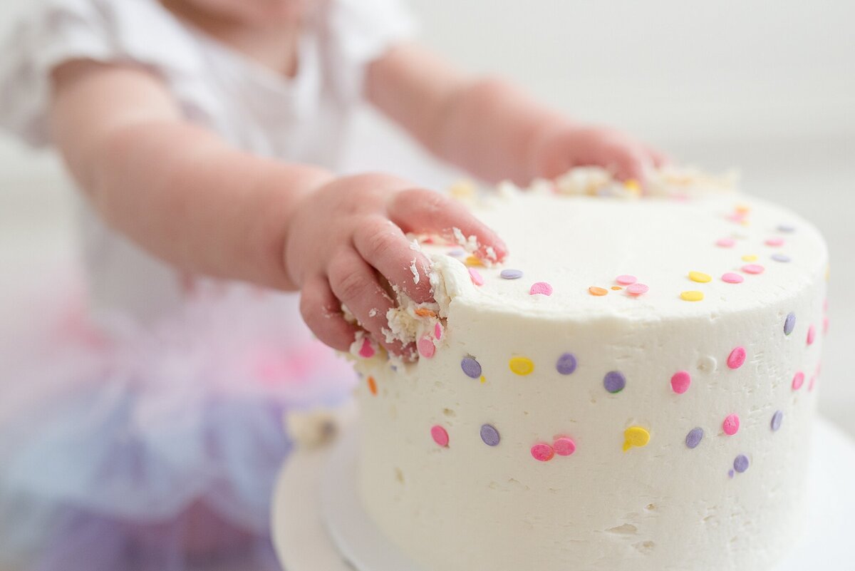 Baby's hand on cake
