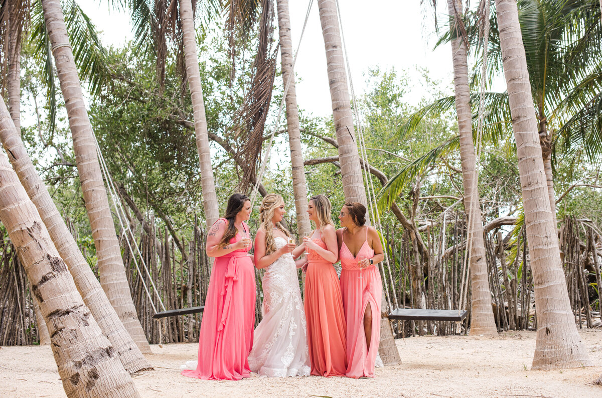 bride and bridesmaids in pink in Cancun