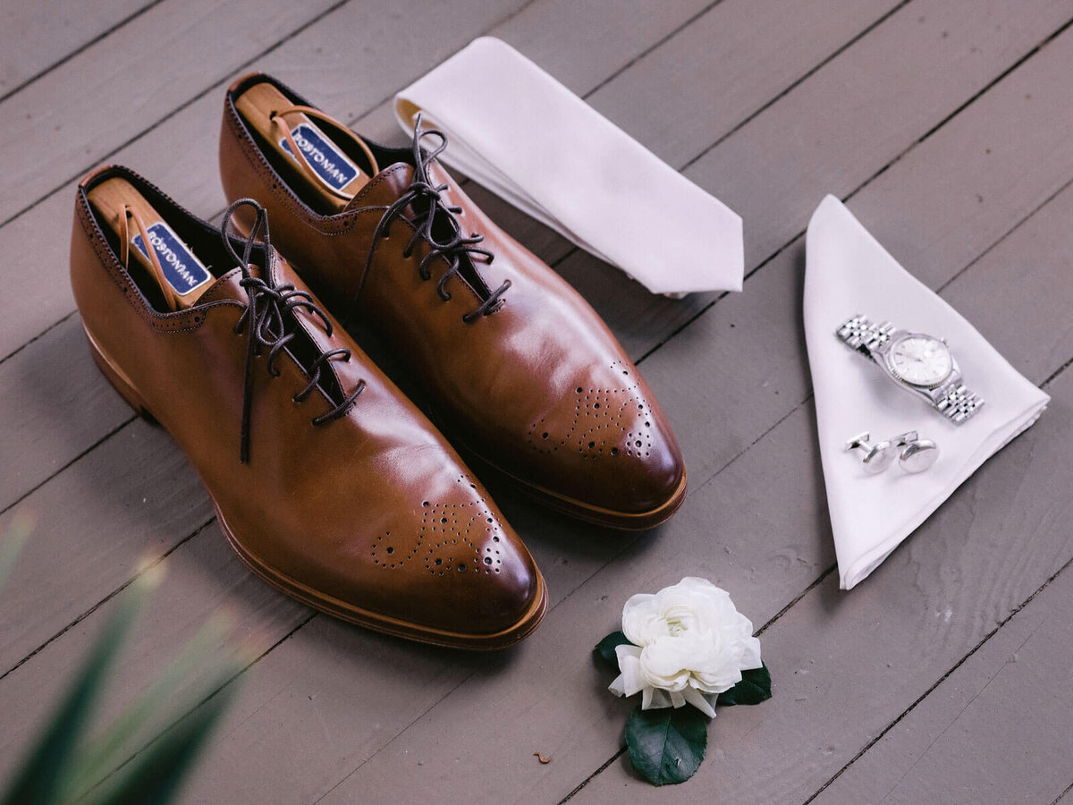 The groom's brown shoes, white necktie, watch in Montage at Palmetto Bluff. Destination wedding image by Jenny Fu Studio