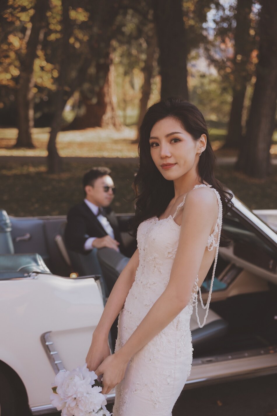 Autumn wedding shoot at Millbrook, Arrowtown. Vintage car & helicopter.