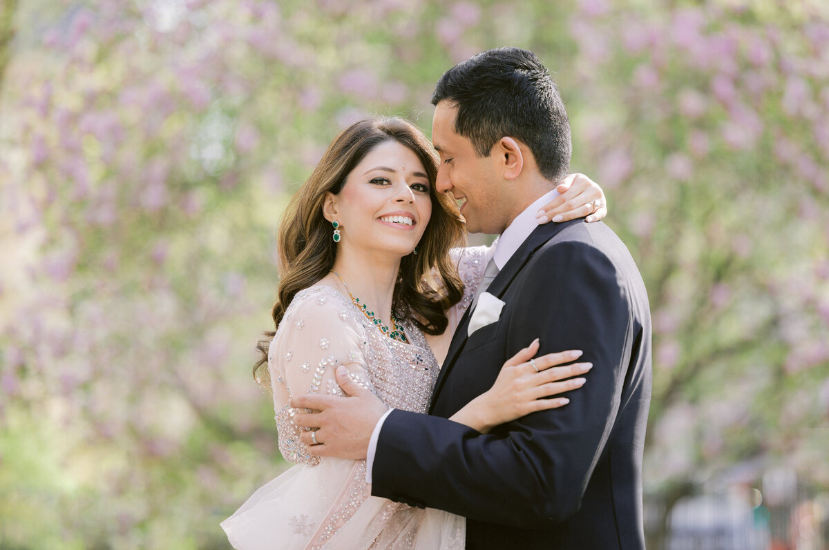 central park spring kiss magnolia tree blooms engagement