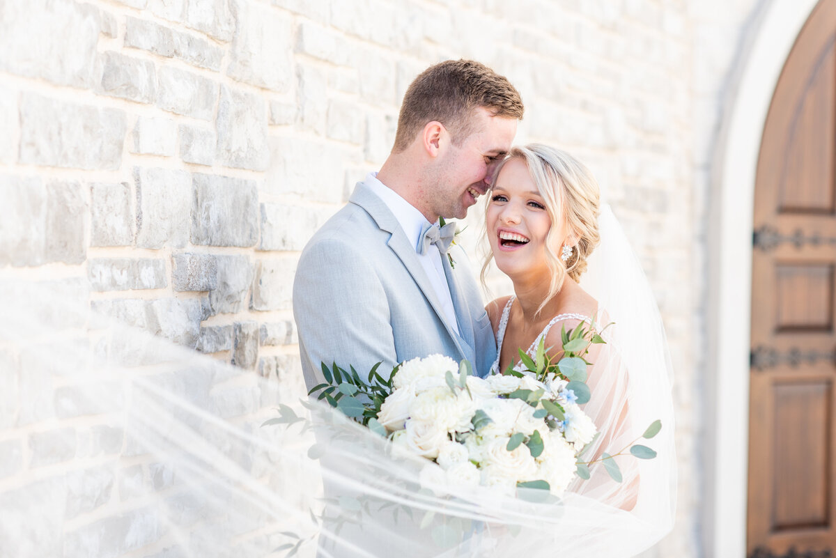 bride laughing with groom
