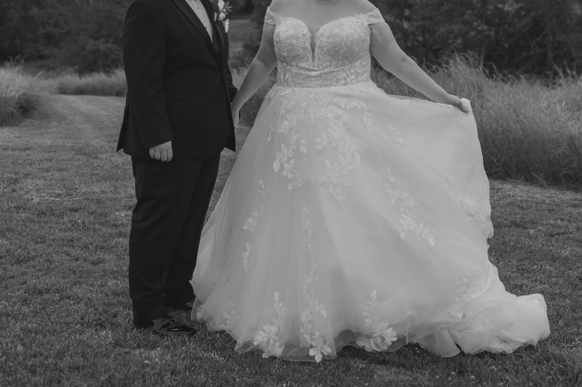 A couple holds hands outdoors