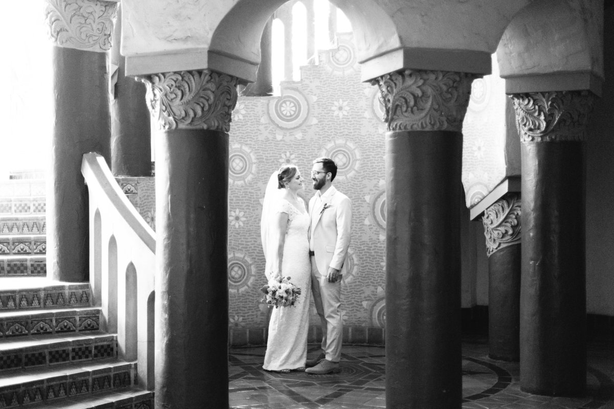 Bride looks at groom after Santa Barbara Courthouse wedding