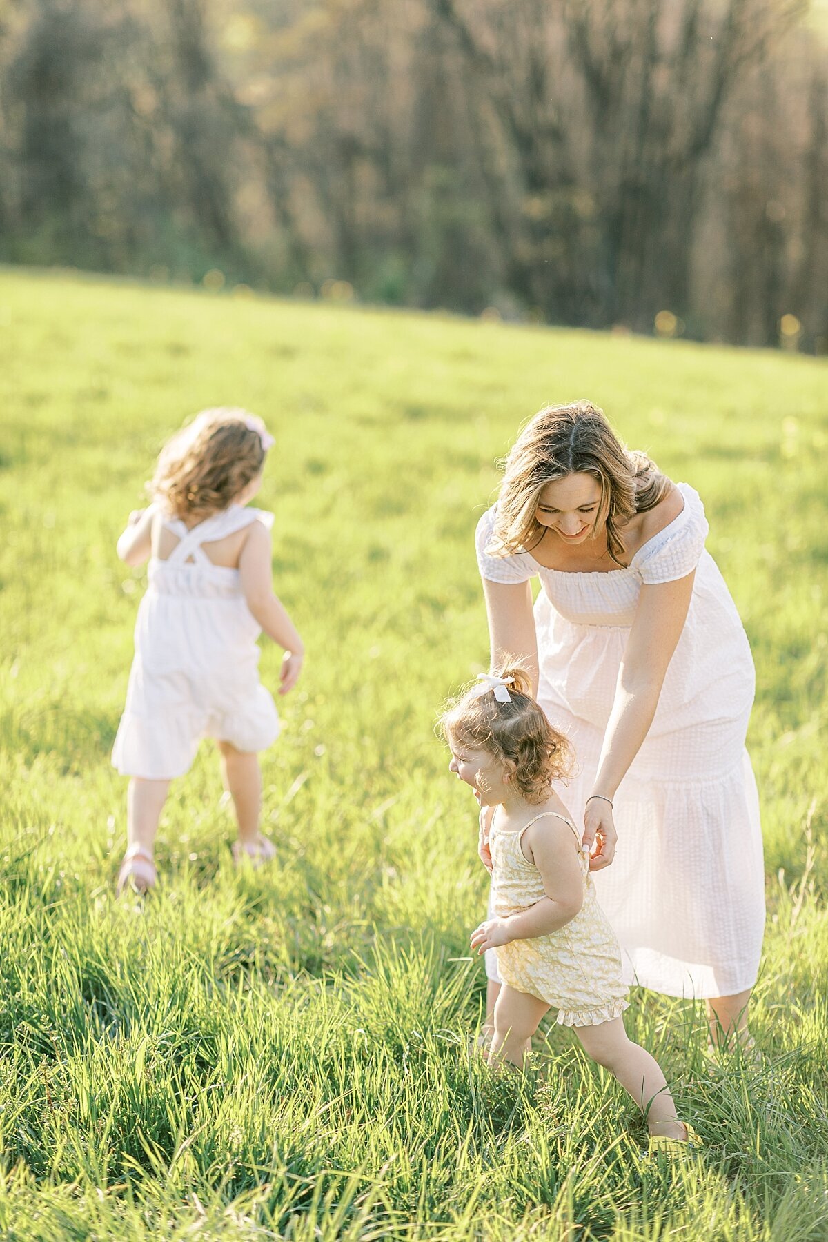 mom playing chase with her children