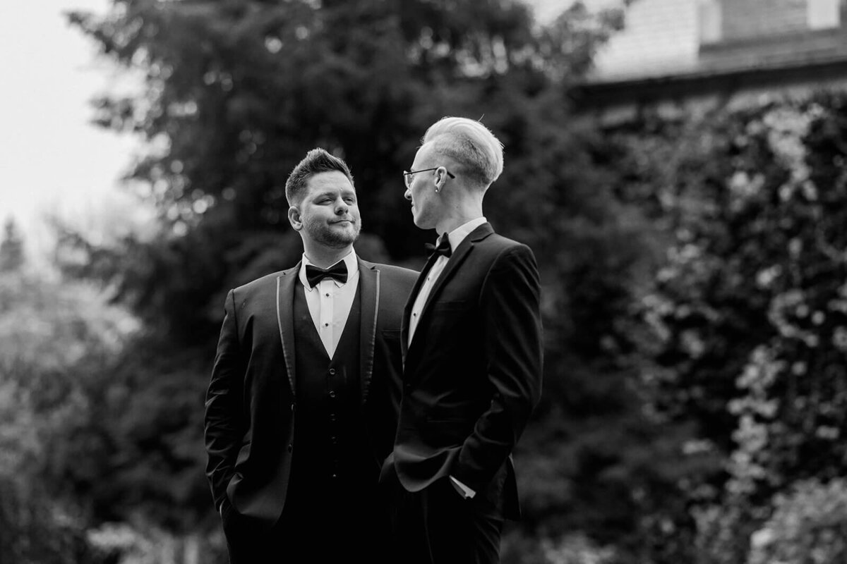 grooms in stylish suits wedding portrait at Greencrest Manor