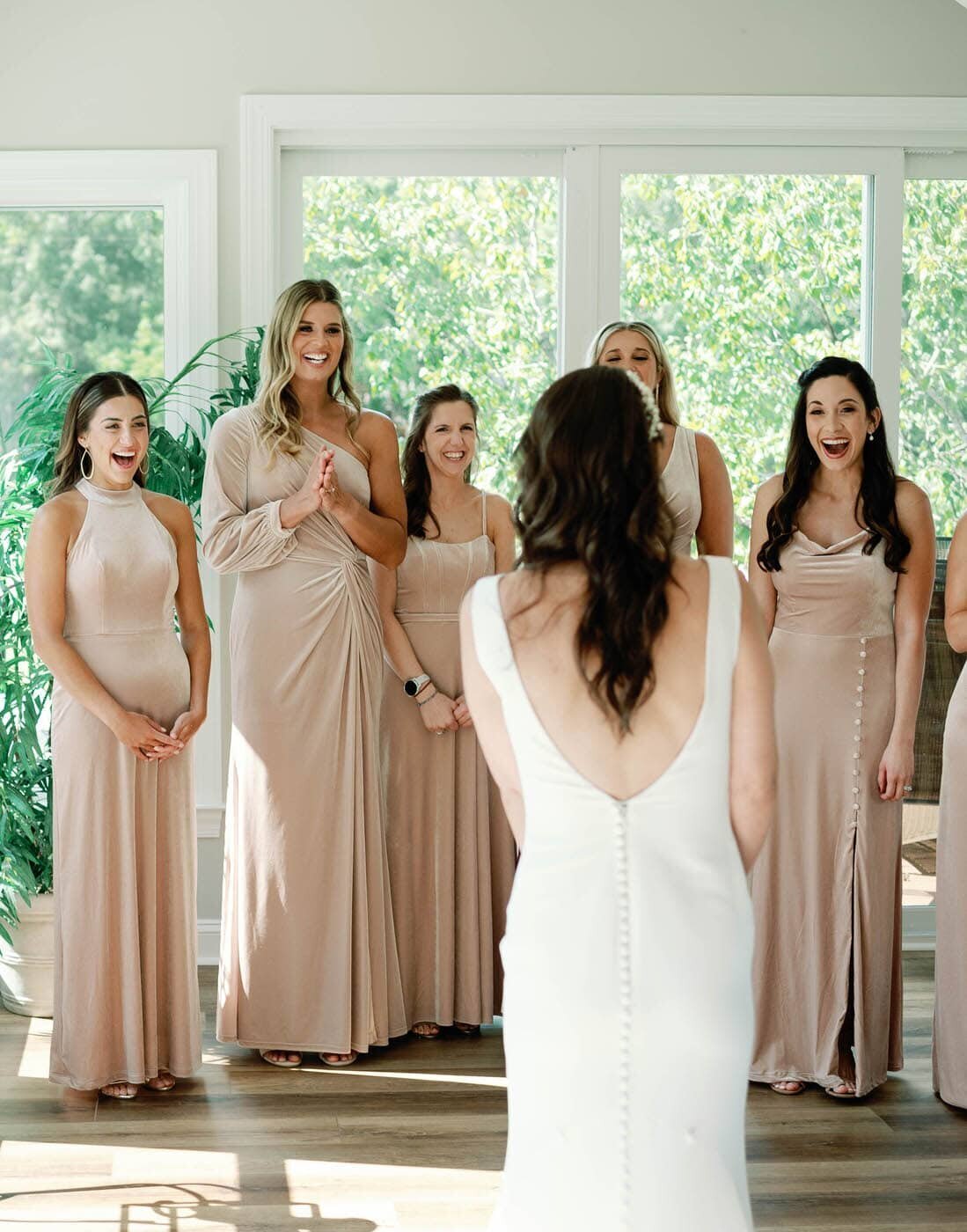 Bridesmaids first look at the bride. 