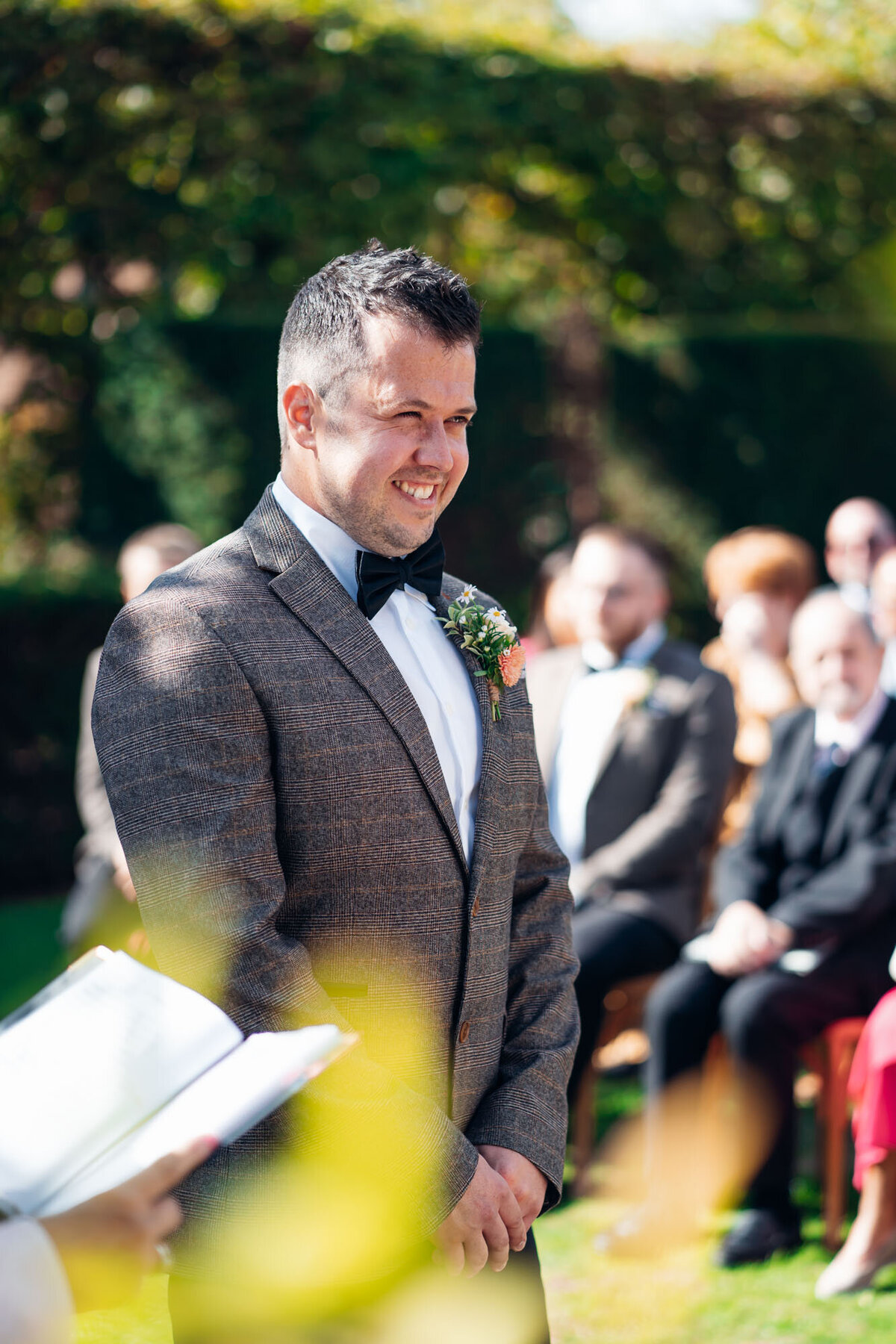 Pauntley-court-wedding-photographer-groom-during-outdoor-ceremony