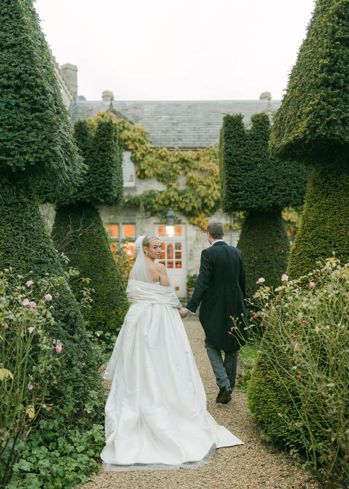 chloe-lowe-wedding-euridge-manor-vivienne-westwood-dress-bride-walking