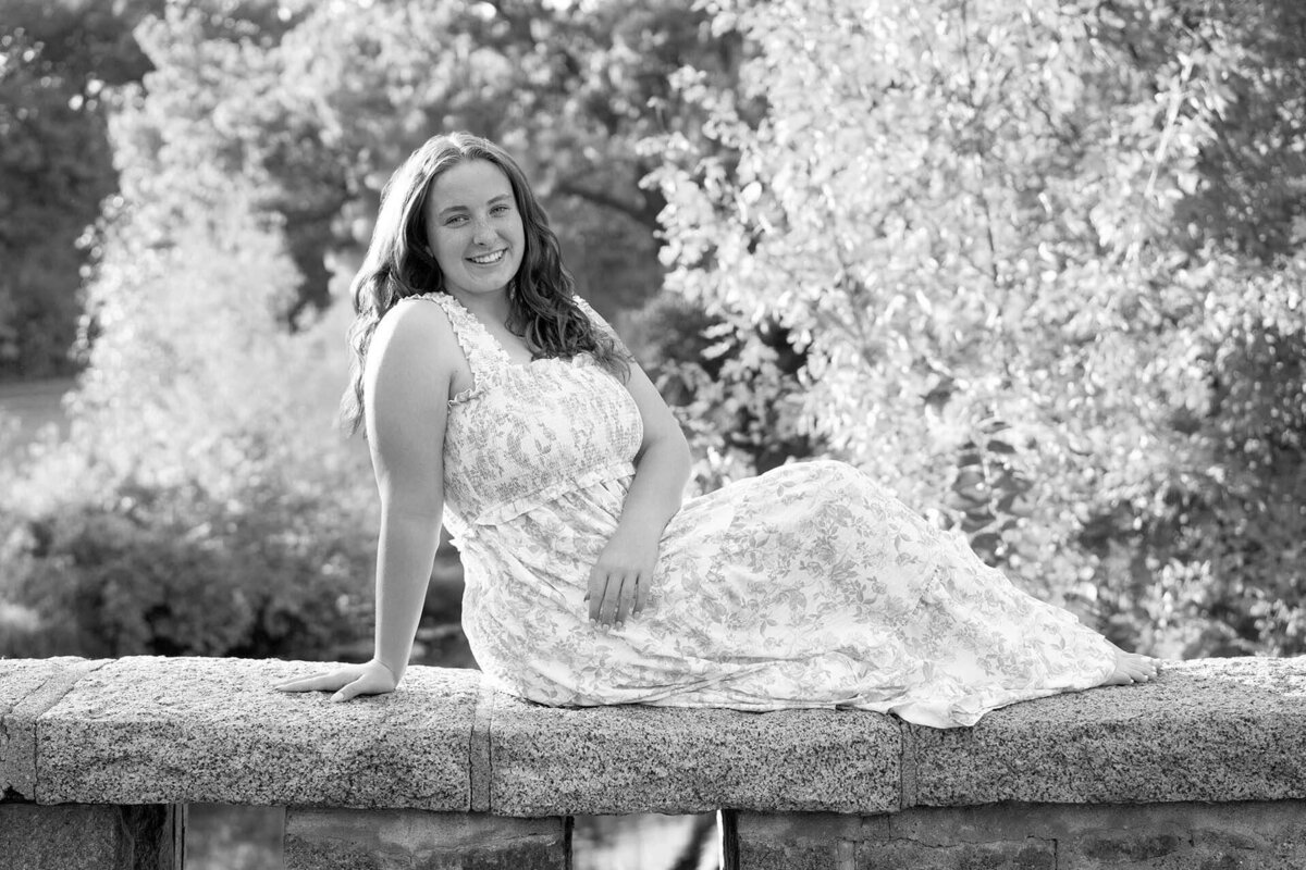 charming-senior-photo-on-bridge-over-creek