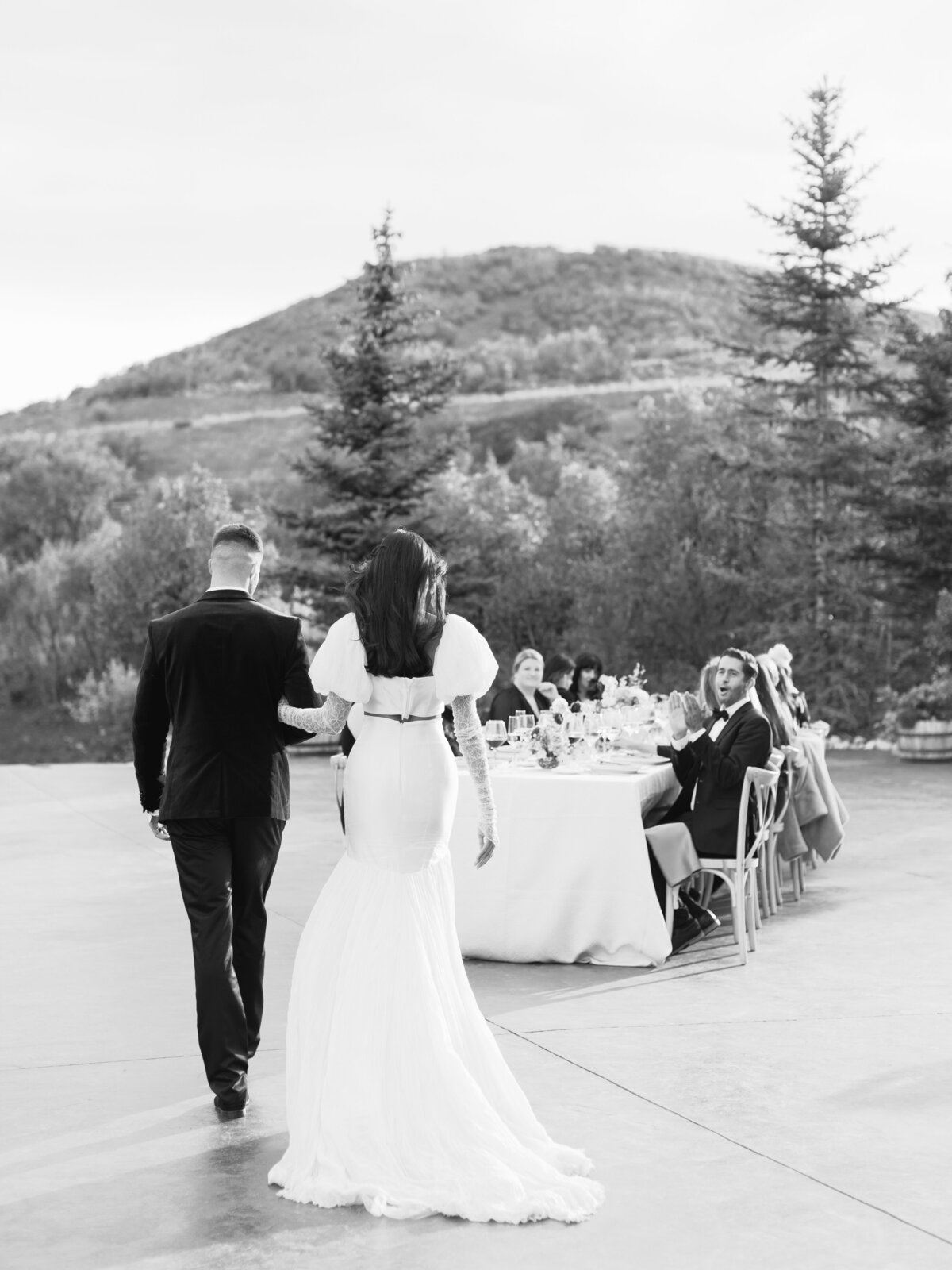 bride-and-groom-walking-towards-guests-cheering