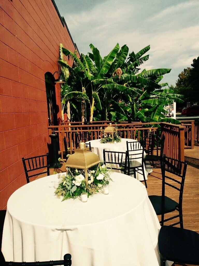 Venue in Pensacola wedding with additional guest seating for dinner on the waterfront deck at Venue Palafox Wharf Waterfront Wedding Venue