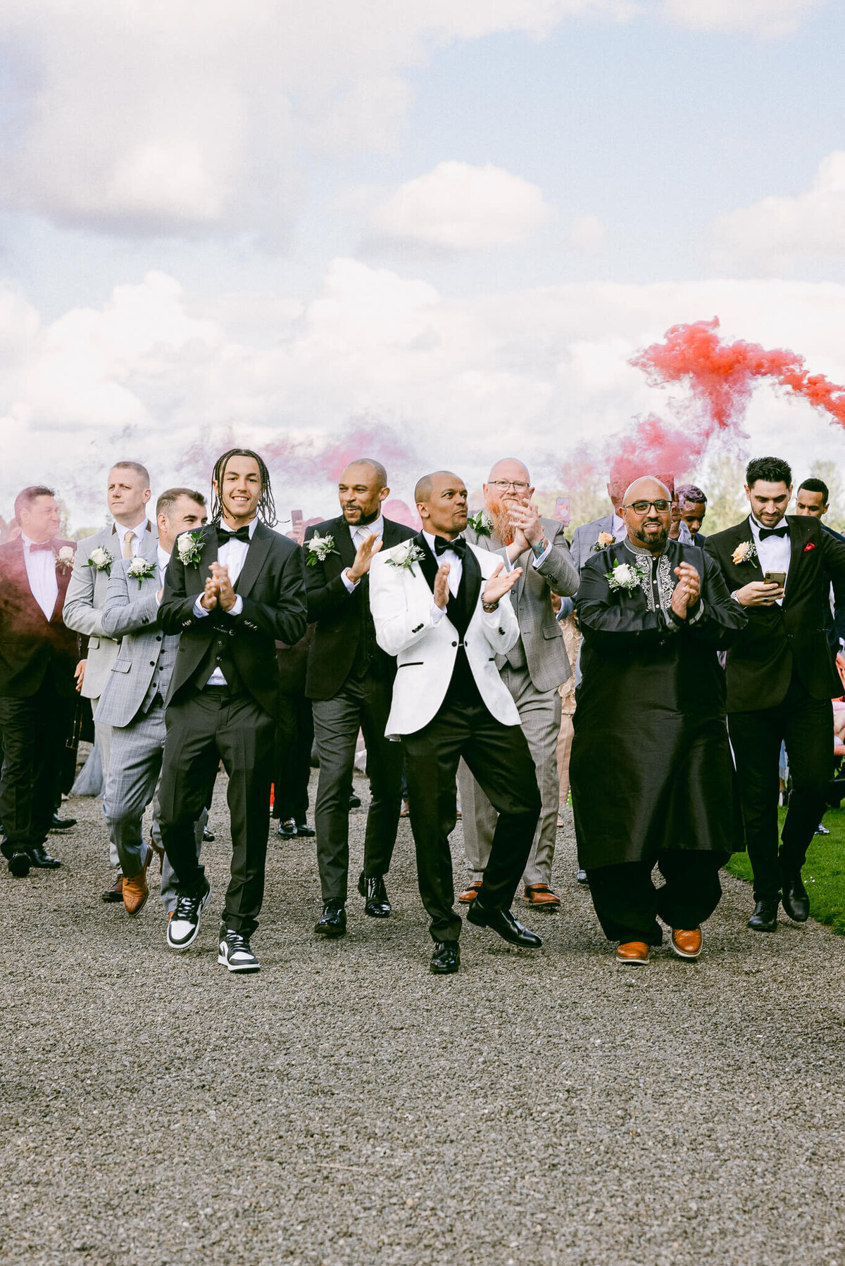 A wedding photo of the groom celebrating with his groomsmen at Luttrellstown Castle in Ireland