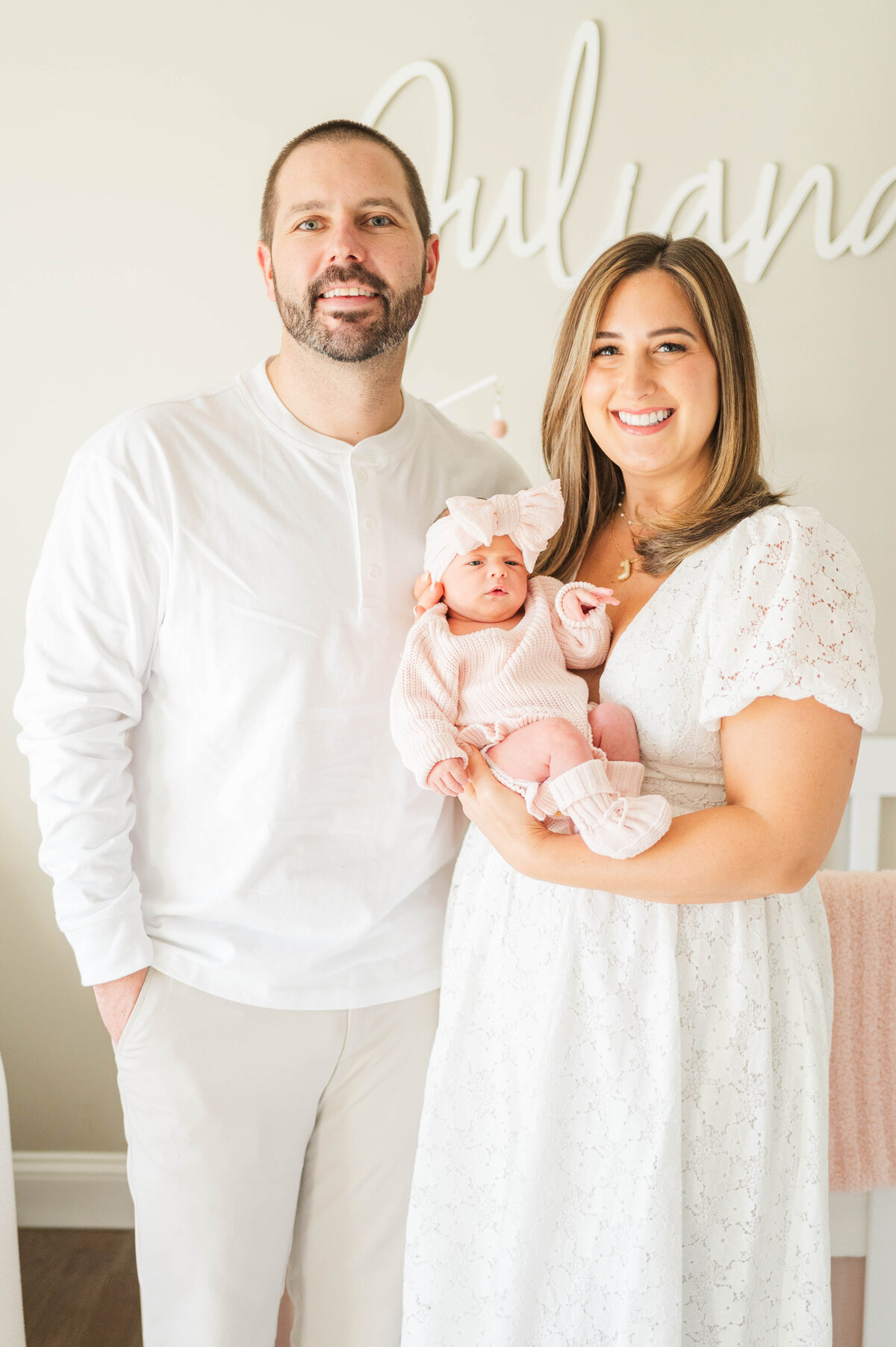 Stunning bright newborn images with mom and dad taken in Douglas, MA by the best newborn photographer in central Massachsuetts