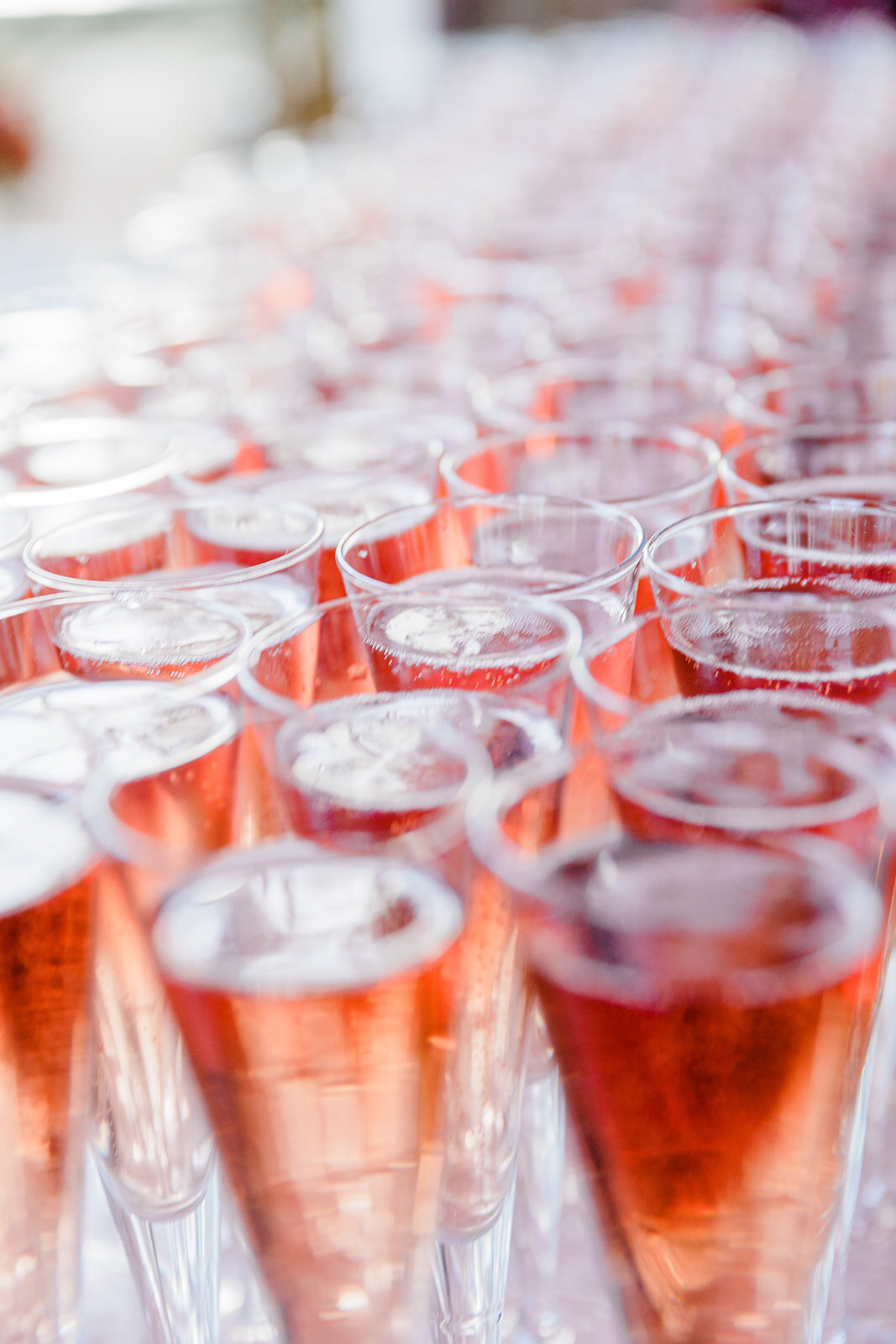 Close-up of champagne glasses at a Château Challain wedding, captured in elegant, romantic fine-art wedding photography.