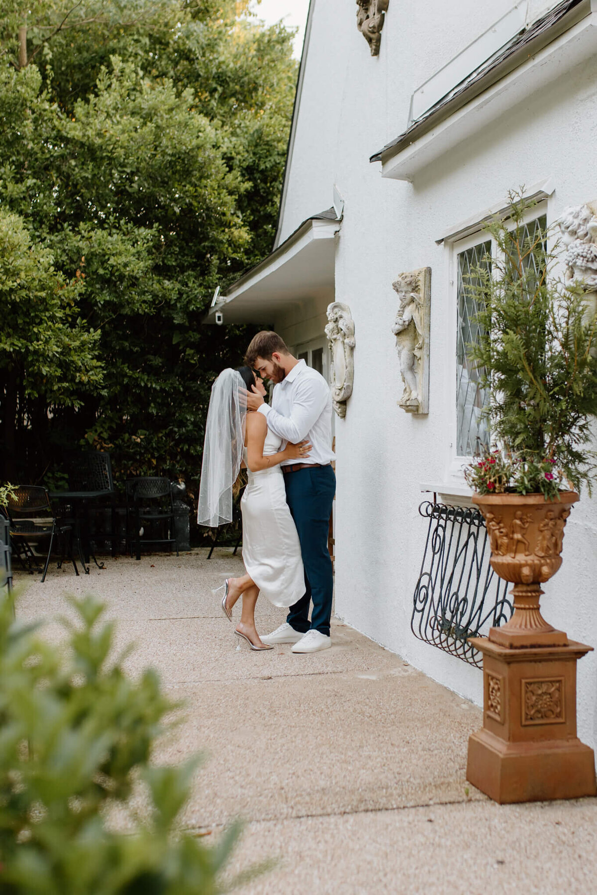 intimate portrait of bride and groom standing outside of a Shreveport, LA elopement venue
